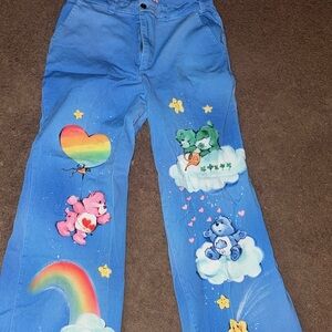 Dolls Kill Blue Flare Jeans with Care Bear Print